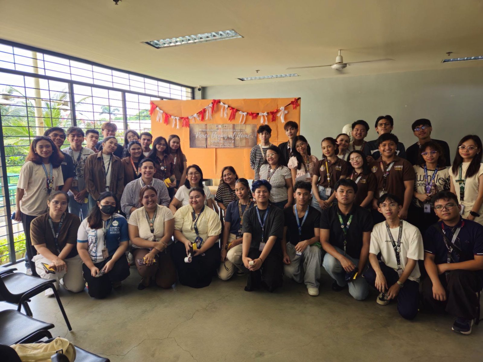 QCU Promotes Family Peace Through “Peace Begins at Home” Wall